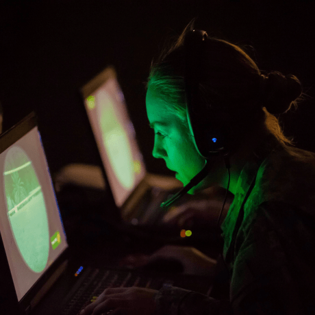 Image of a student using a cyber lab at Norwich University