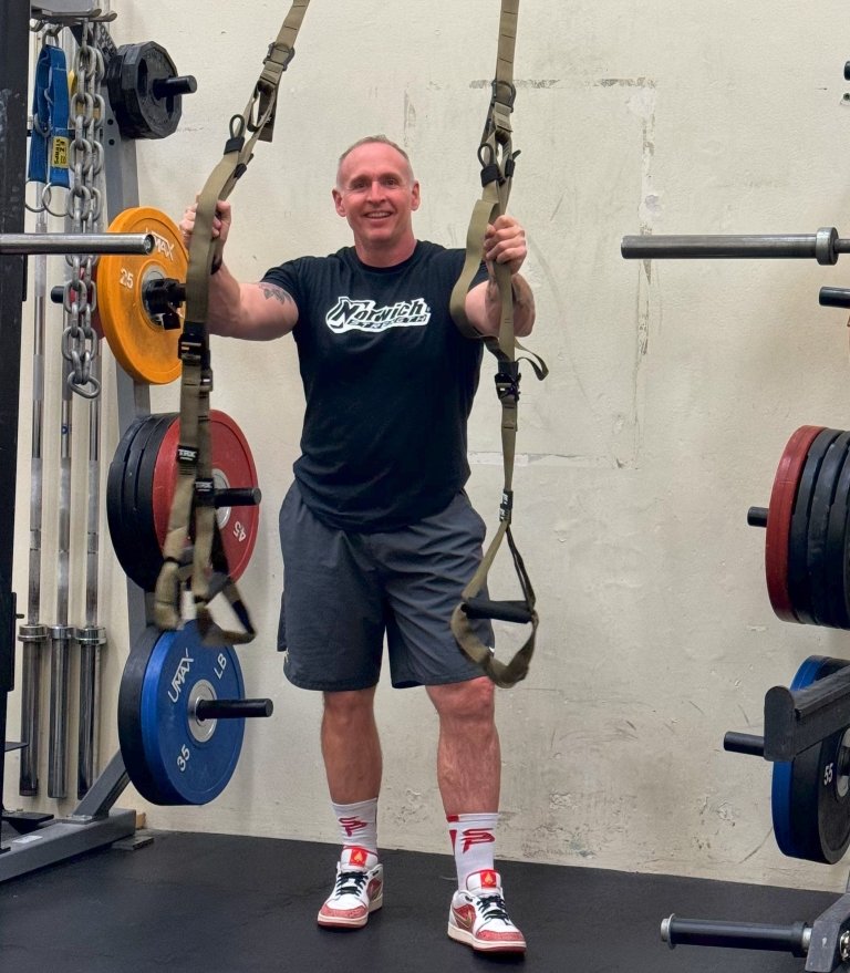 Caulfield standing in weight room