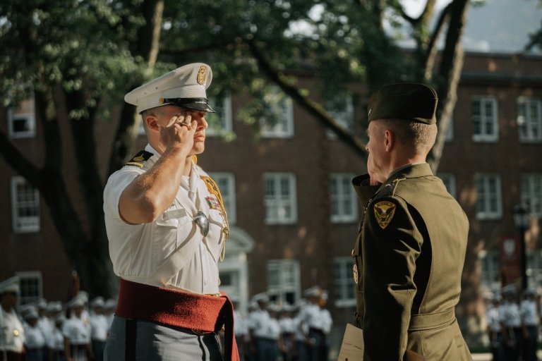 Cadet Thoren Berg salutes 56th Commandant of Cadets and Vice President of Student Affairs William McCollough ’91